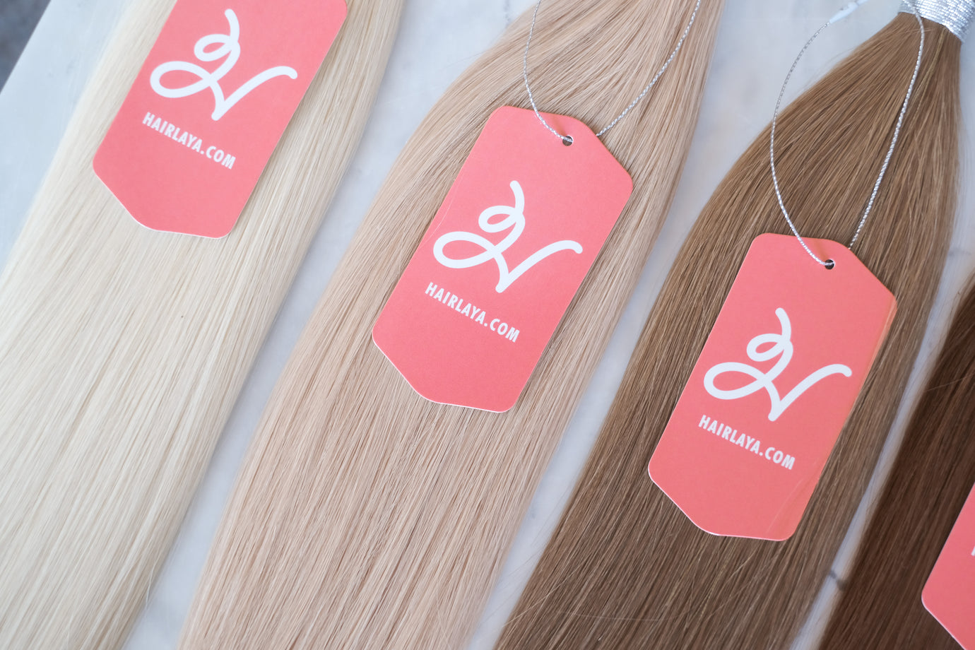 Hairlaya hand-tied extensions. Hand-tied and tape-in extensions are similar and different.